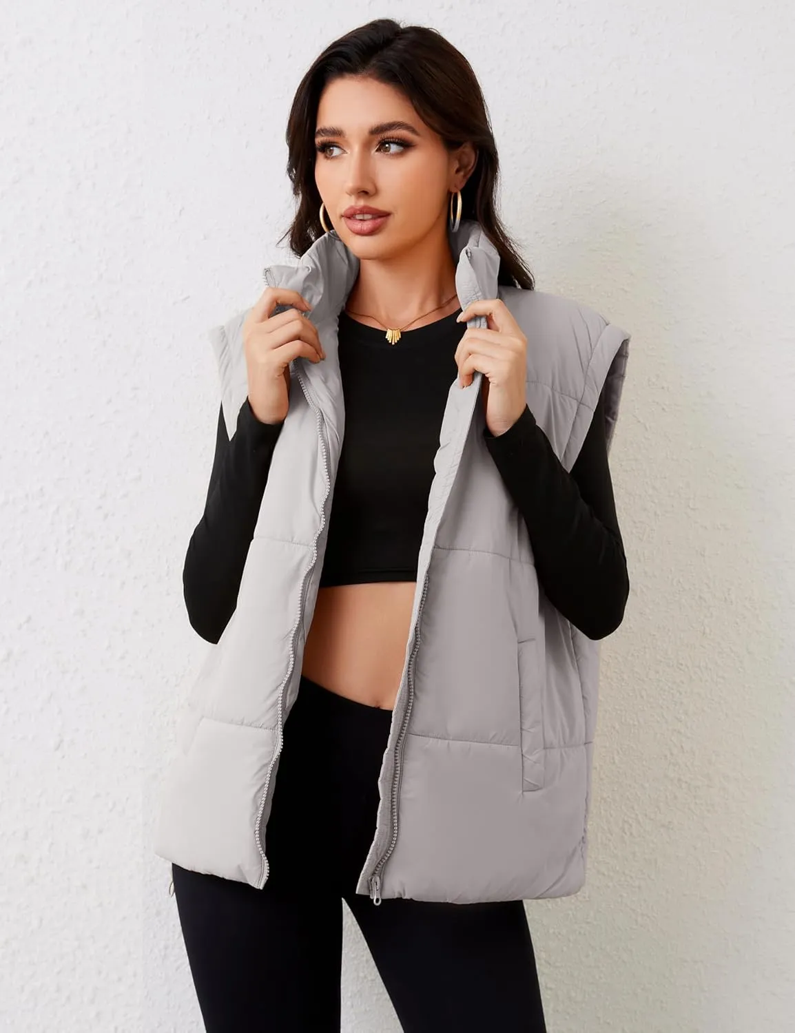 APAFES Women Winter Oversized Puffer Vest Lightweight Stand Collar Flysleeve Insulated Padded Puffy Jackets Coat with Pockets